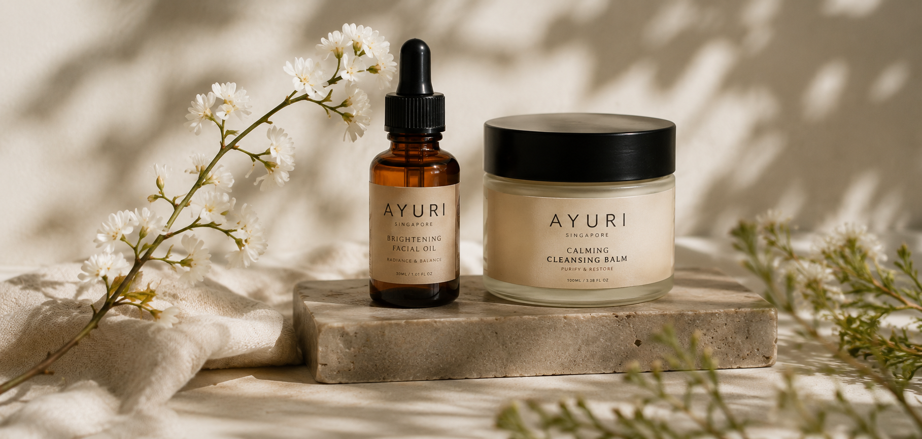 Singapore skincare products styled on a stone plinth